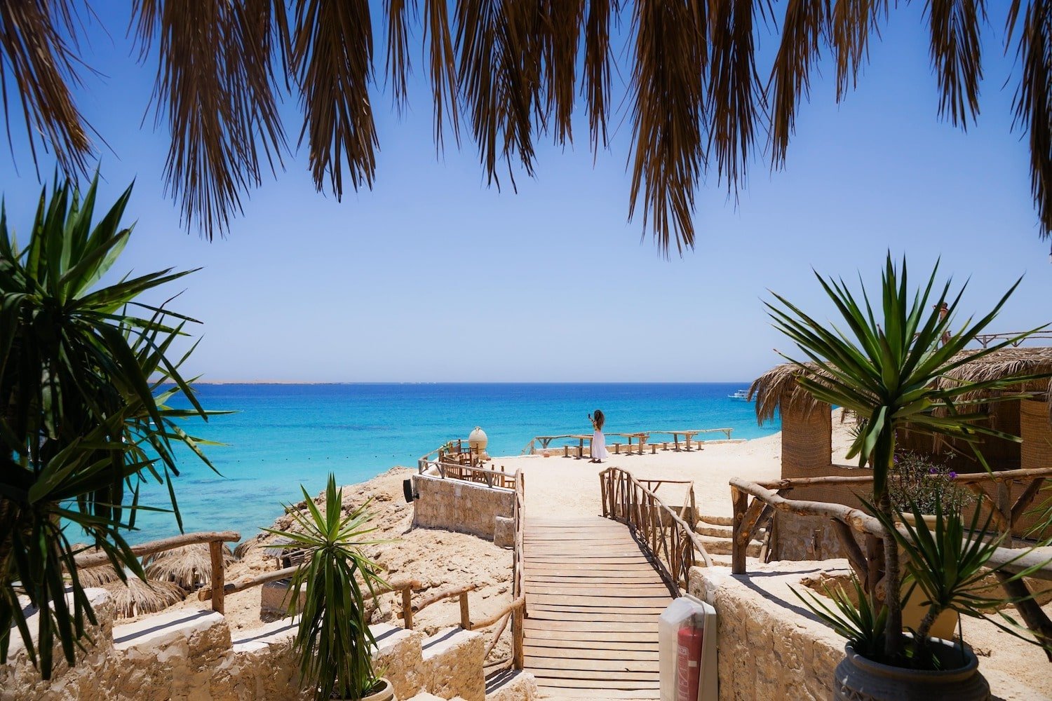 White sandy beach with shaded huts on Mahmya Island, Hurghada